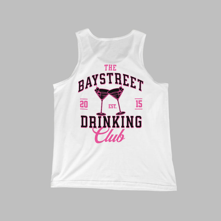 White tank top with pink and black text on a gray concrete surface